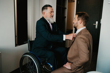 Father and son on their wedding day getting ready