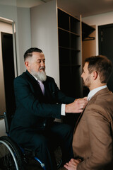 Father and son on their wedding day getting ready
