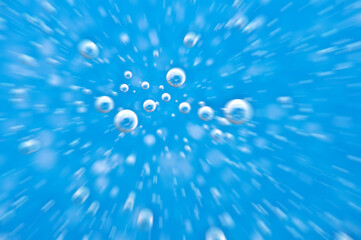 Water close up. Movement of water with oxygen bubbles. Blue beautiful underwater background