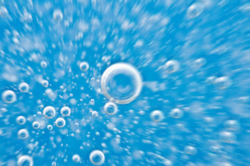 Water close up. Movement of water with oxygen bubbles. Blue beautiful underwater background