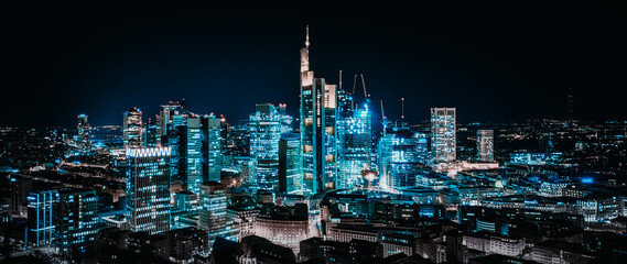 high angle view of city skyline illuminated in blue at night, frankfurt main, germany