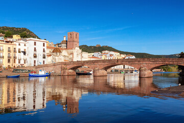 River with Homes and Apartments in Touristic Town. Bosa, Sardinia, Italy. Sunny Fall Season Day....