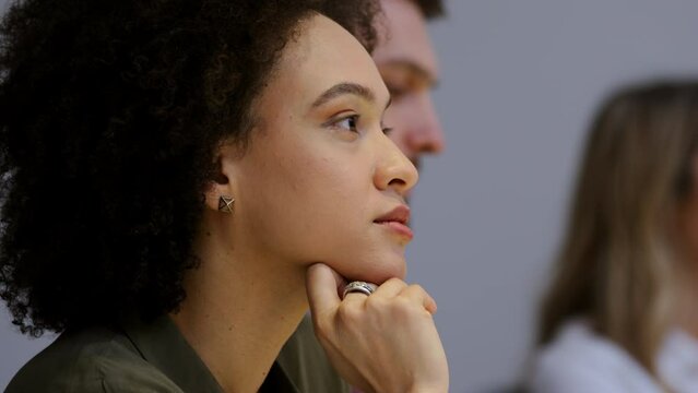 Afrcan american business woman attentively listening in meeting