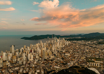 Obraz na płótnie Canvas aerial photo with drone of the city of Balneário Camboriú at sunrise