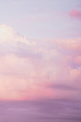 Sky with soft and fluffy pastel pink and blue colored clouds. Sunset background. Nature. sunrise. Instagram toned style. Vertical