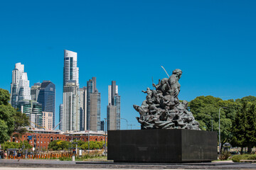 Buenos Aires downtown landmark: national hero Juana Azurduy sculpture with puerto madero skyscrapers in the background