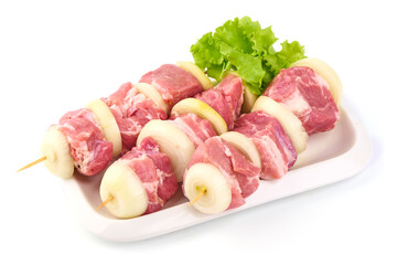 Raw pork skewers, ready to cook, BBQ, isolated on white background.