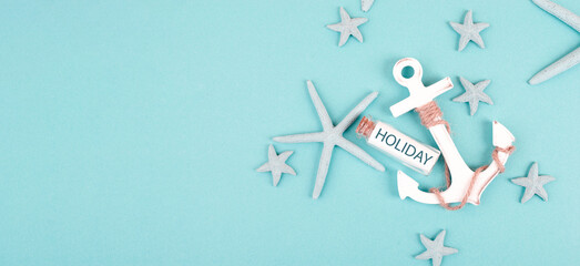 Summer vacation background, anchor, sea stars and a glass bootle with the word holiday, travel and tourism concept