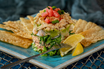 Crab Stack with Corn Chips and Lemon Wedges