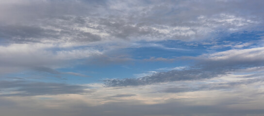 Fototapeta premium Blue sky with clouds background overlay. Ideal for sky replacement 