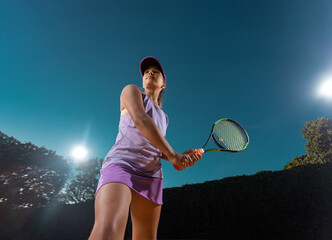 Tennis player. Girl teenager athlete with racket on tennis court. Download high resolution photo for article at sports website.