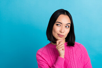Portrait of funny suspicious minded woman wear pink knitted jumper touch chin looking empty space hmm deep think isolated on blue color background