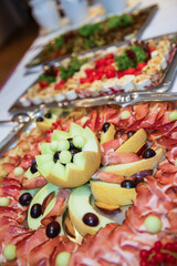 buffet with designed melon and ham 