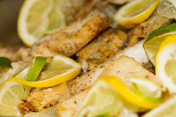chicken meal with lemons on a buffet