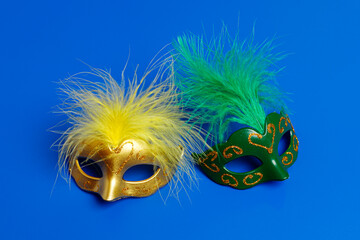 Multicolored carnival mask on blue background. Purim.