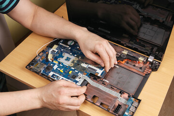 Installation of motherboard inside housing, laptop repair