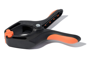 Fototapeta premium Large plastic clamp on a white isolated background