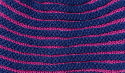 Texture of a knitted blue fabric. Detail of clothing