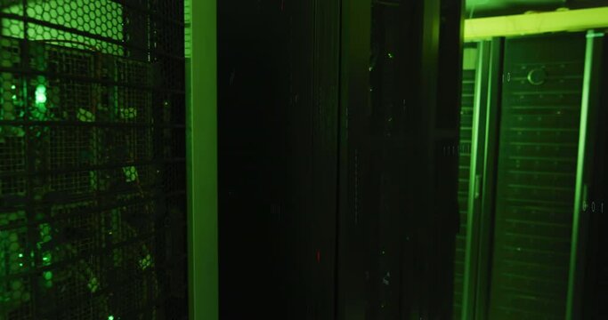 Animation of binary coding data processing and symbols against computer server room