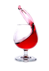 moving a glass of red wine on a white background