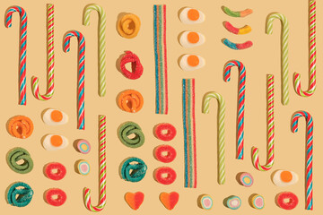 Pattern of gummy candies on yellow background