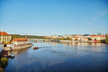 Obraz premium Panoramic view of pleasure boat on the Vltava river in Prague.