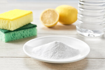 Environmentally friendly detergent - baking soda on a white wooden table.