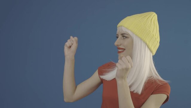 Happy lady is pointing away at copy space. Slog2 ungraded LOG 10bit 422 ProRes raw chroma key footage