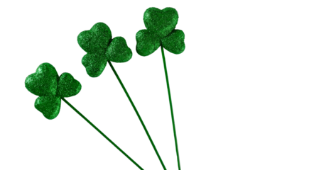 St. Patrick's Day holiday background with copy space by green glitter clovers.