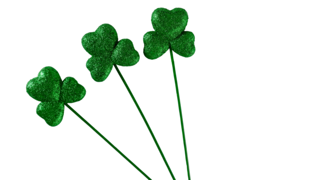 St. Patrick's Day holiday background with copy space by green glitter clovers.