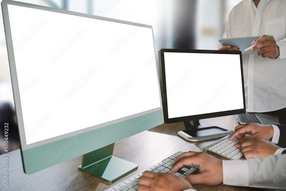 Poster a businessman is working on a mock-up. using a laptop with a blank copy space screen for your advert