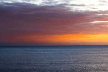 The Inferno on the Horizon: An Ominous Sunset over the Ocean.