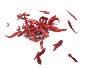 Dried Red hot Chilli fall down in Glass Bowl, dried Red Chilli float explode, abstract cloud fly. Dried Red hot Chillis splash throwing in Air. White background Isolated high speed shutter, freeze