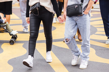 young couple walks on a city street