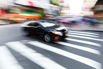 car in city traffic in abstract motion blur