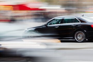 Fototapeta na wymiar car in city traffic in abstract motion blur