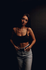 tanned girl on a black background