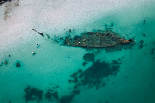 Top down view of people snorkelling the Omeo Shipwreck at Coogee Beach in Perth, Western Australia