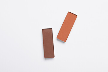 Beautiful eye shadow refill pans on white background, flat lay
