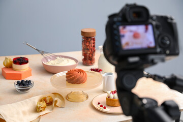 Fototapeta na wymiar Professional equipment and composition with delicious dessert on beige table in studio. Food photography