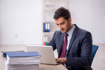 Young male employee working in the office