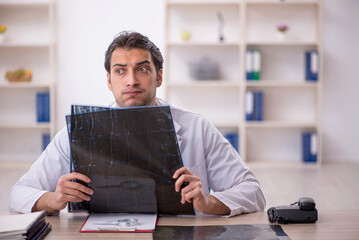 Young male doctor radiologist working in the clinic