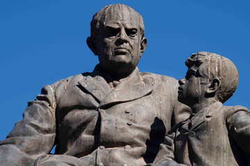 Monument of Domingo Fautino Sarmiento seated with two children in the Plaza 25 May made in bronze...