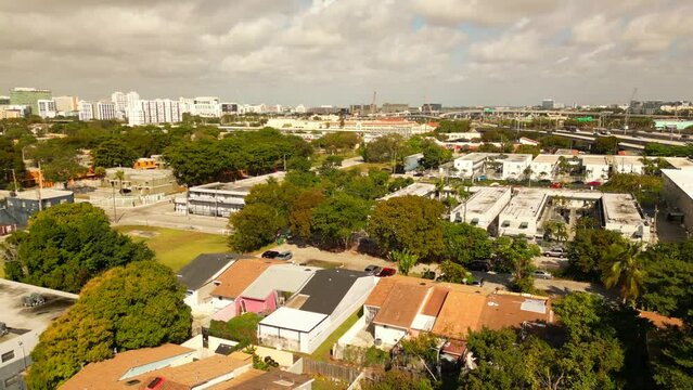 Aerial reveal homes in Overtown Miami. 4k drone footage low income high crime area Dade County