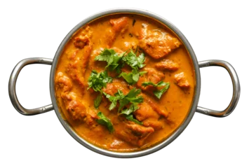 Fotobehang indian butter chicken curry in balti dish top down view and isolated with cilantro garnish © Joshua Resnick
