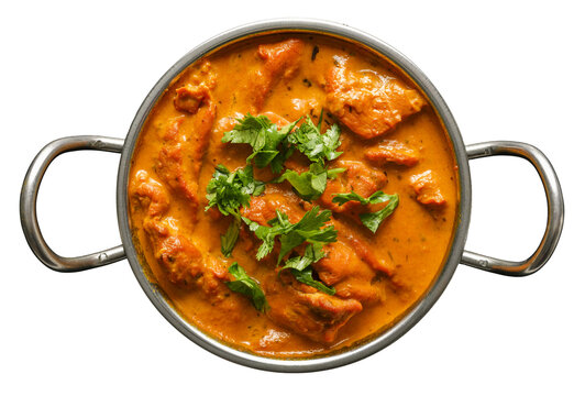 indian butter chicken curry in balti dish top down view and isolated with cilantro garnish