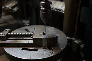Part machining with drilling machine