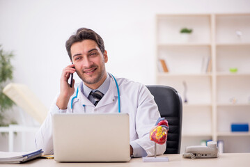 Young male doctor in telemedicine concept