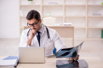 Young male doctor radiologist working in the clinic