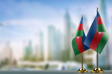 Small flags of the Azerbaijan on an abstract blurry background